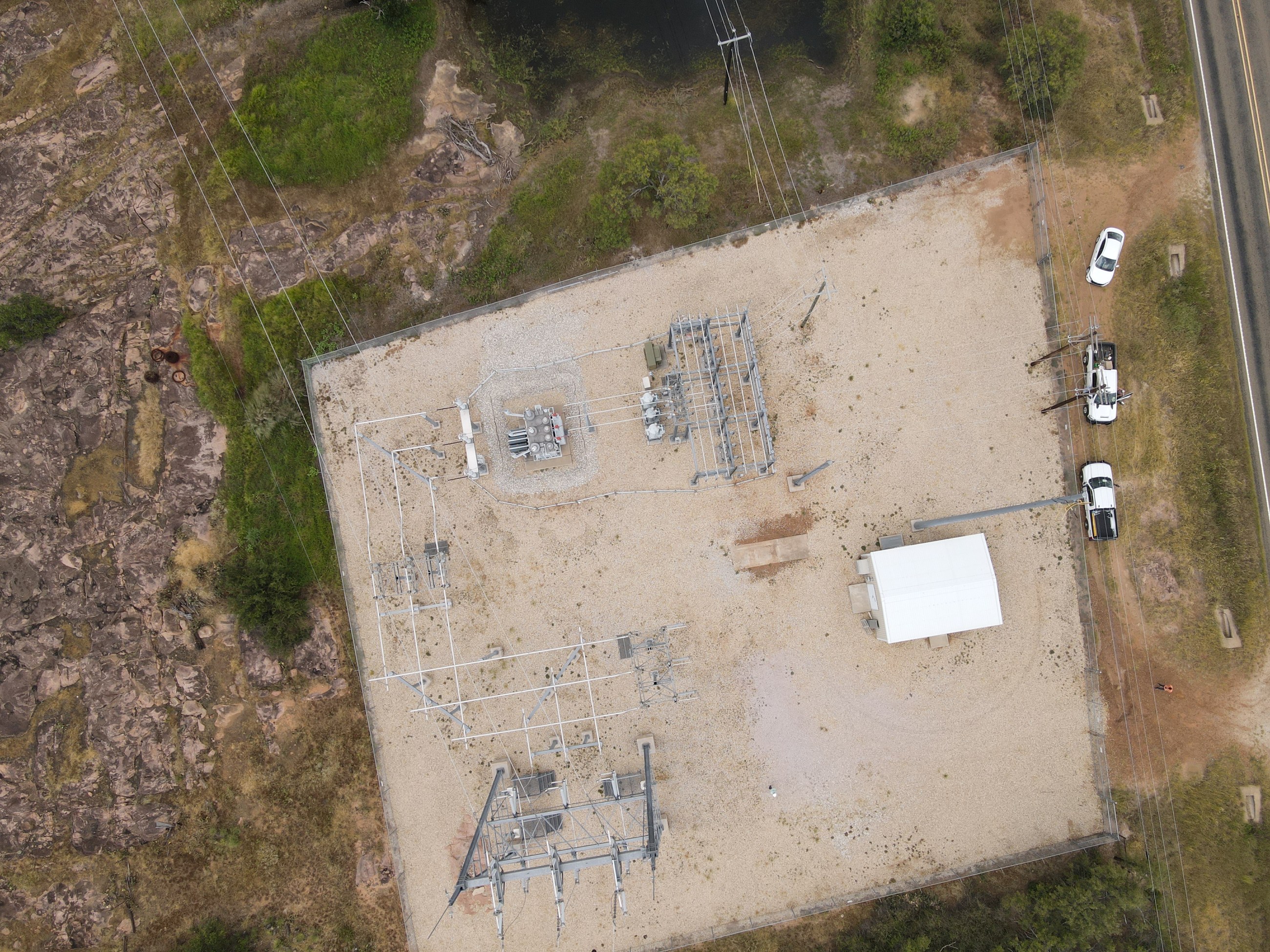 Aerial view of a fenced distribution substation pad